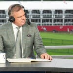 paul mcginley i grå kostym