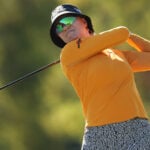golfspelaren madelene sagström i orange golftröja