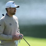 golfspelaren mikael lindberg i vit golfkeps och beige golftröja