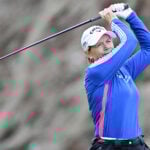golfspelaren annika sörenstam i varma golfkläder