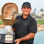 Patrick Reed of the United States poses with the trophy