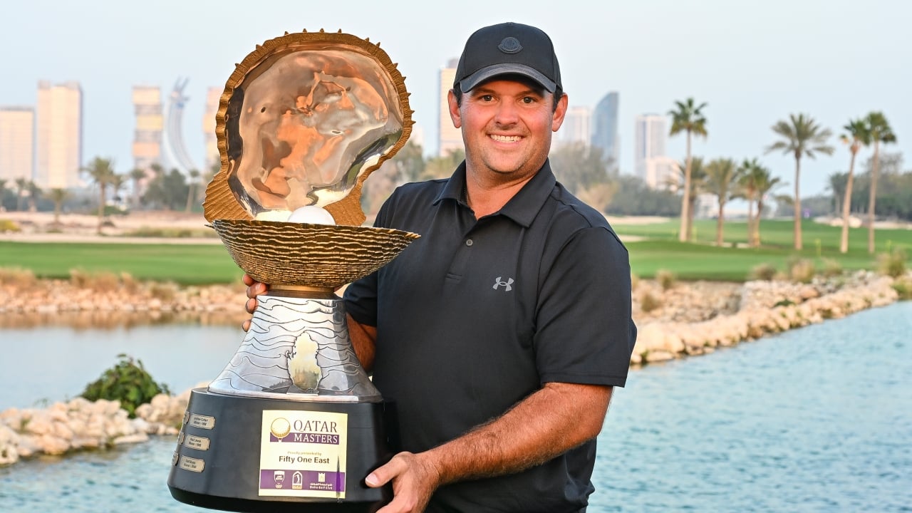 Patrick Reed of the United States poses with the trophy