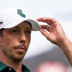 golfspelaren björn hellgren i vit golfkeps och grön golfpiké