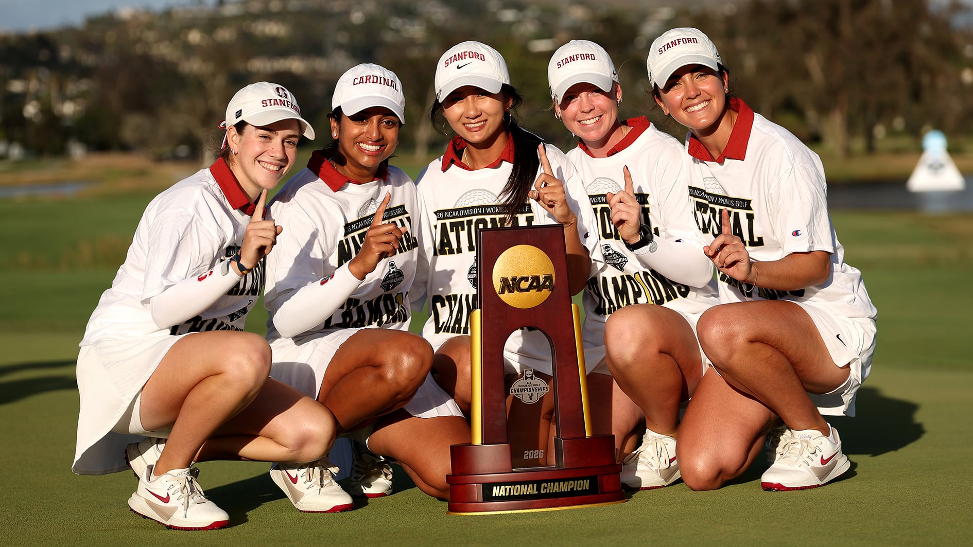 CARLSBAD, CALIFORNIA - MAY 27: Paula Martin Sampedro, Andrea Revuelta, Meja Ortengren, Kelly Xu, and Megha Ganne of the Stanford University Cardinals pose on the 18th green with the national championship trophy after defeating the USC Trojans during the final round of the NCAA Division I Women's Golf Championships at Omni La Costa Resort & Spa on May 27, 2026 in Carlsbad, California. (Photo by Luke Hales/Getty Images)