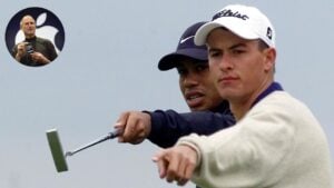 US golfer Tiger Woods (L) gives instructions to Au